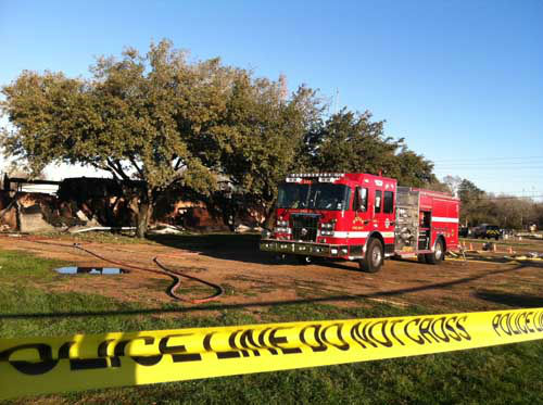 Galveston firefighters stand by in the hallways...