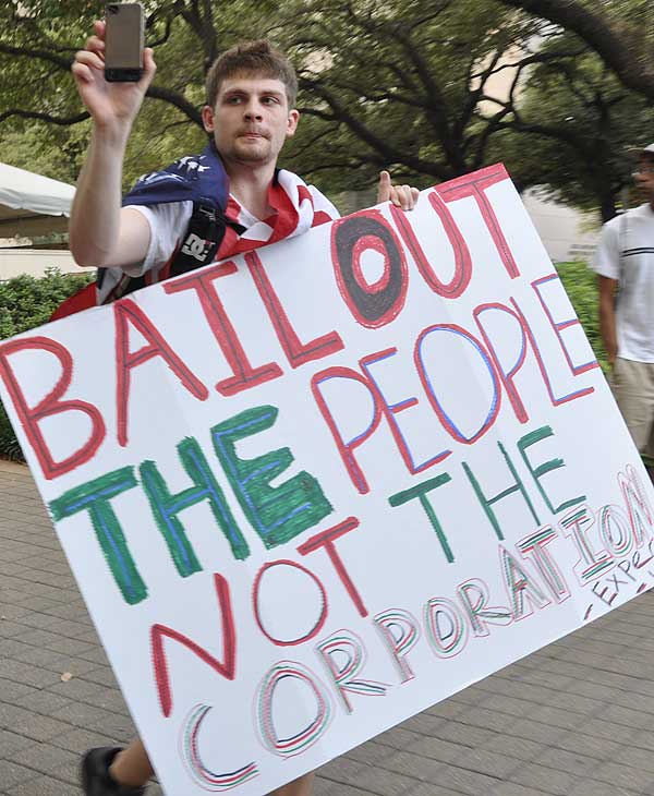Houston protesters join the Occupy movement to...