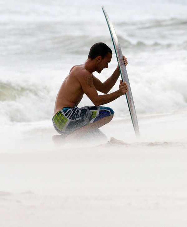 Mark Mitchell surveys the damage to boats at...