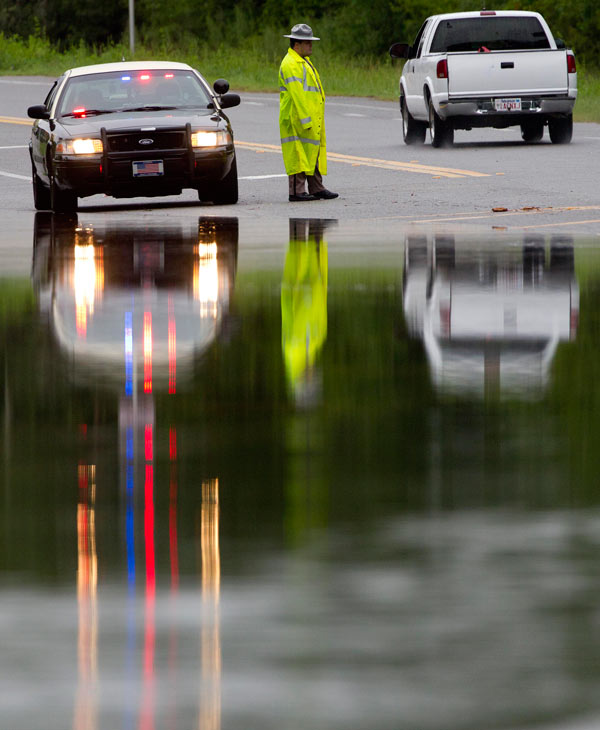 Mark Mitchell surveys the damage to boats at...