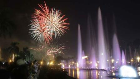 Filipinos watch a fireworks and water fountain display as they welcome the New Year at Manilas Rizal Park, Philippines on Sunday Jan. 1, 2012. More than 200 people have been injured by illegal firecrackers and celebratory gunfire in the Philippines despite a government scare campaign against reckless New Year revelries, officials recently said. (AP Photo/Aaron Favila)