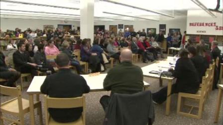 More than 100 parents, teachers and supporters gather to press a school board to reinstate a kindergarten teacher