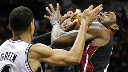 Miami Heats LeBron James (6) is defended by San Antonio Spurs Danny Green during the second half at Game 5 of the NBA Finals basketball series, Sunday, June 16, 2013, in San Antonio. (AP Photo/Eric Gay)