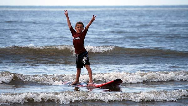 Kids ages 6 - 17 are hitting the waves in Galveston with the professional instructors at Ohana Surf Camp. (Photo: Gina Larson)