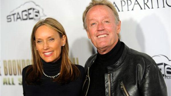 Peter Fonda, a cast member in The Boondock Saints II: All Saints Day, poses with his wife Portia Rebecca Crockett at the premiere of the film in Los Angeles, Wednesday, Oct. 28, 2009. - Provided courtesy of AP / Chris Pizzello Peter Fonda, a cast member in The Boondock Saints II: All Saints Day, poses with his wife Portia Rebecca Crockett at the premiere of the film in Los Angeles, Wednesday, Oct. 28, 2009. - Provided courtesy of AP / Chris Pizzello