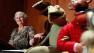 FILE- in this Wed., Aug. 25, 2010 photo, Jane Henson, left, donates some of Jim Hensons early puppets, including the original Kermit, to the Smithsonian Institution, during a ceremony at the National Museum of American History, in Washington.