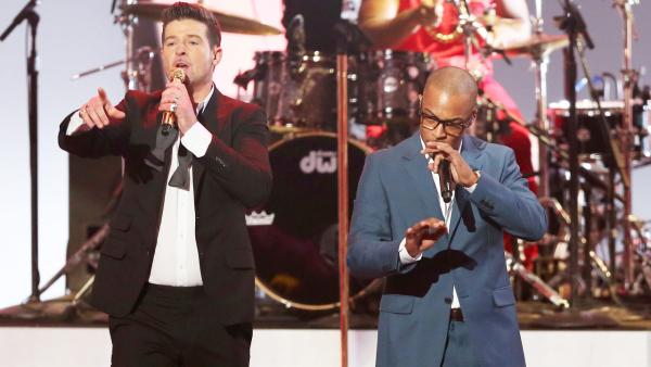 Robin Thicke, left, and T.I. perform Blurred Lines at the Grammy Nominations Concert Live! on Friday, Dec. 6, 2013, at the Nokia Theatre L.A. Live in Los Angeles. - Provided courtesy of AP / Matt Sayles/Invision/AP