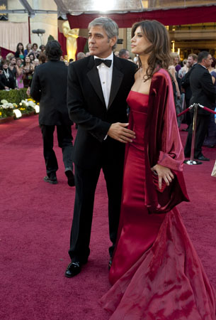 George Clooney and Elisabetta Canalis on the red carpet, 2010.