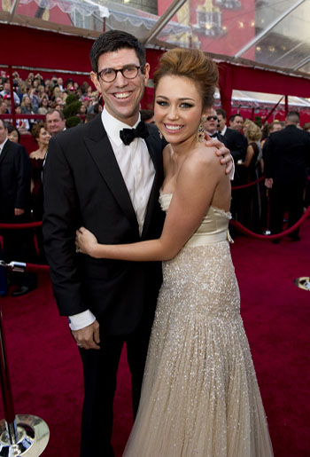 Rich Ross and presenter Miley Cyrus on the red...