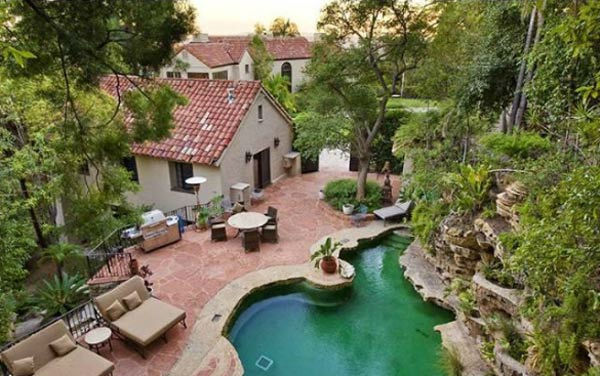 The pool and guest house at Katy Perry and Russell Brand's Hollywood Hills home. The seven-bedroom, nine bathroom house is 8,835 square feet and was purchased by the couple for $6.5 million.