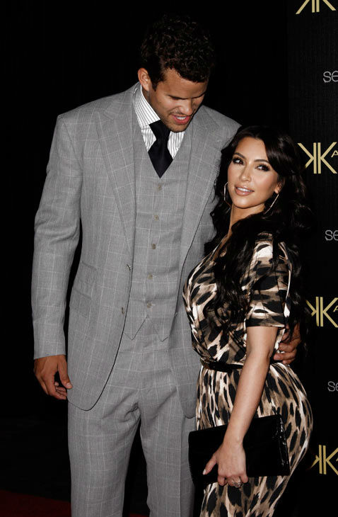 Kim Kardashian, right, and her fiance, NBA...