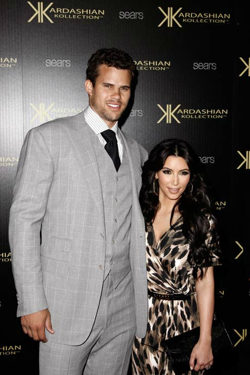 Kim Kardashian, right, and her fiance, NBA...