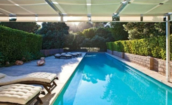 The lap pool at Brad Pitt's Mid-Century Modern Malibu beach house which the actor put on the market for $13.75 million. The 4,088 square foot home, which was designed by architect Chris Sorenson, has 4-bedrooms, 4-bathrooms, a swimming pool and ocean view