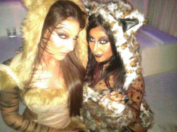 'Jersey Shore' star Nicole 'Snooki' Polizzi dressed up as a cat for Halloween. She is seen above with her friend Ryder <a href=