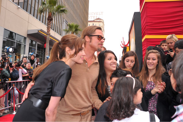Angelina Jolie and Brad Pitt arrive at...