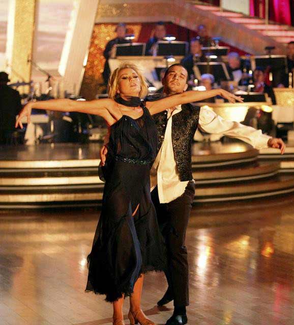 Chelsea Kane and her partner Mark Ballas dance a...