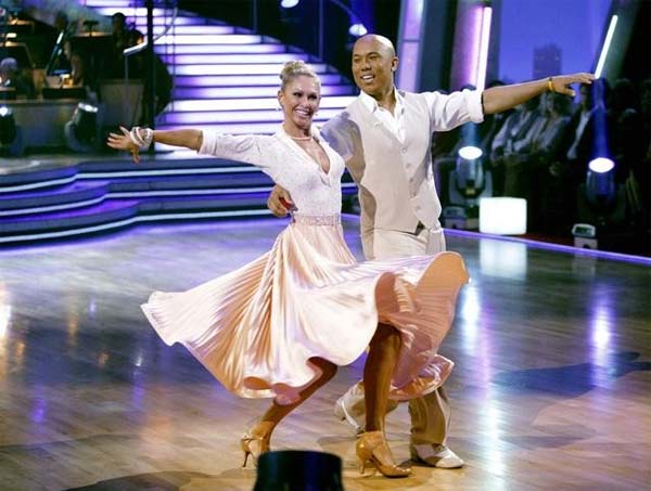 Hines Ward and his partner Kym Johnson dance a...