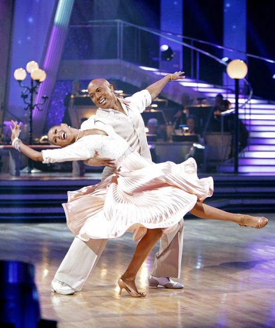 Hines Ward and his partner Kym Johnson dance a...