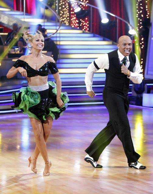 Hines Ward and his partner Kym Johnson dance a...