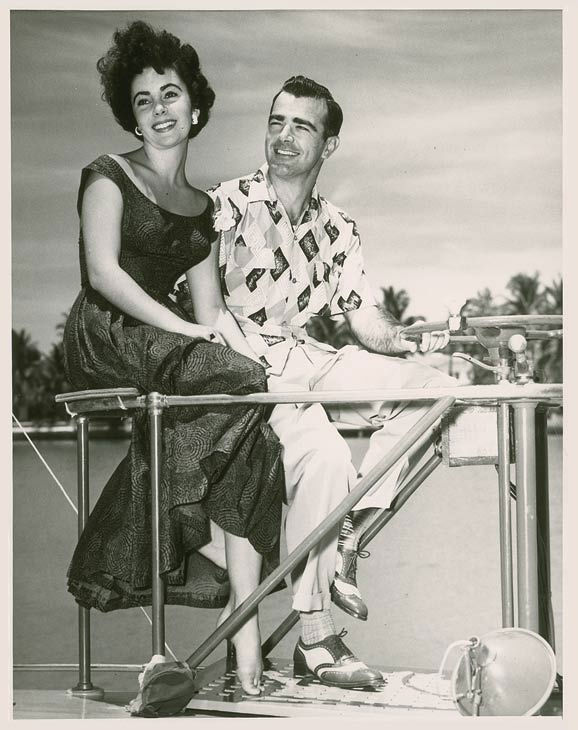 Elizabeth Taylor and William Pawley Jr. seen in...