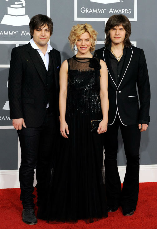Neil, left, Kimberly, center, and Reid Perry of...
