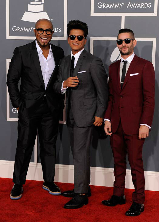 Bruno Mars, center, and The Smeezingtons arrive...