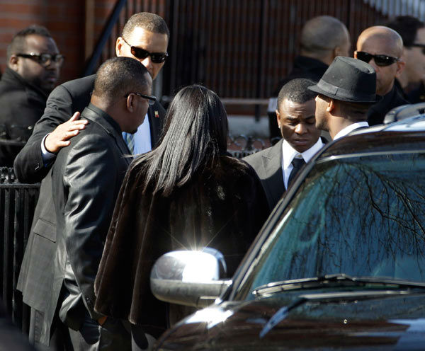 Singer Bobby Brown, left, is seen outside during...