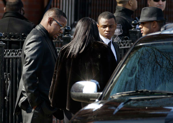 Singer Bobby Brown, left, is seen outside during...