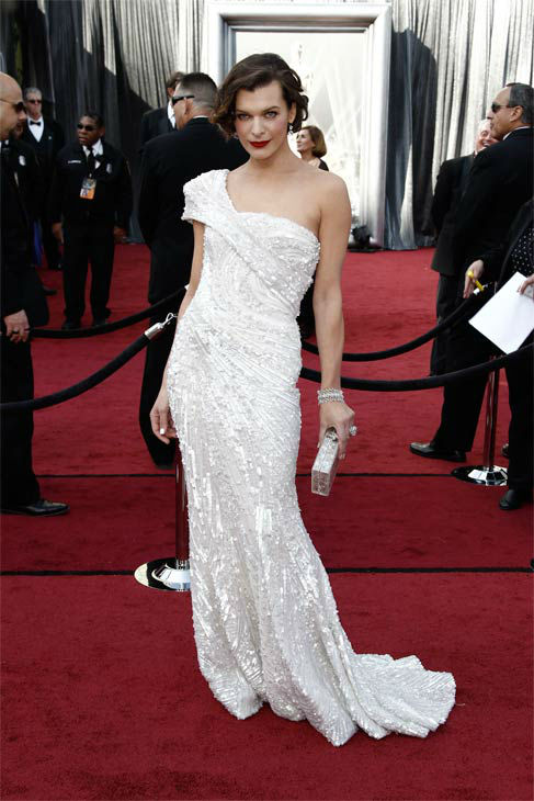 Milla Jovovich arrives before the 84th Academy Awards on Sunday, Feb. 26, 2012, in the Hollywood section of Los Angeles.