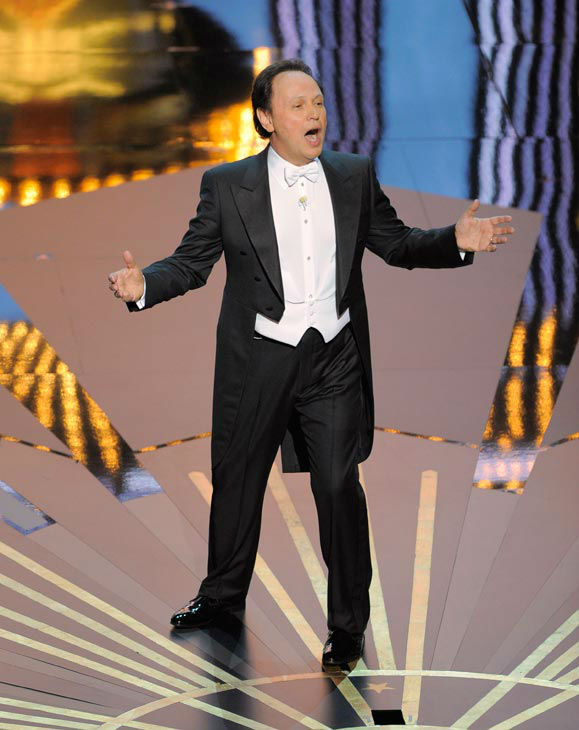 Host Billy Crystal performs onstage during the...