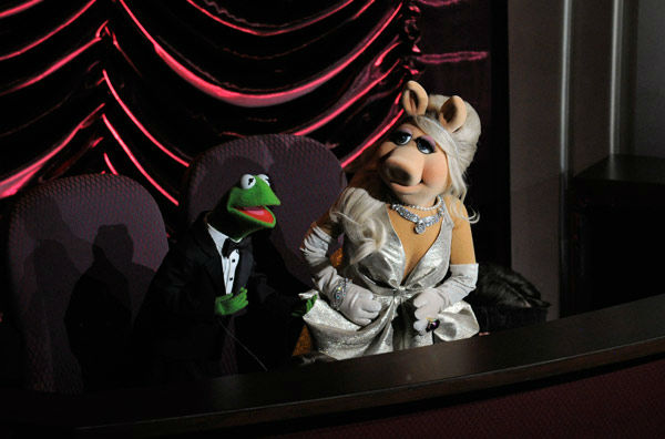 Muppets Kermit the Frog, left, and Miss Piggy...