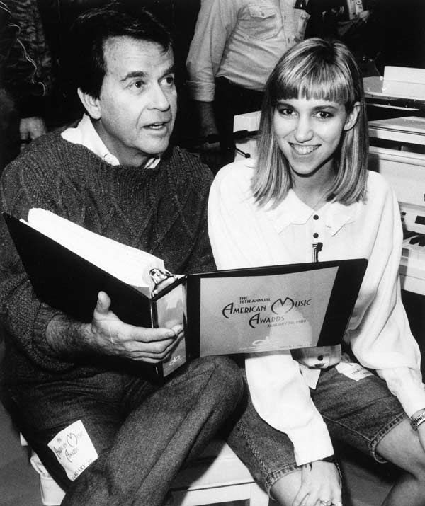 Executive producer Dick Clark and teen singing Executive producer Dick Clark and teen singing