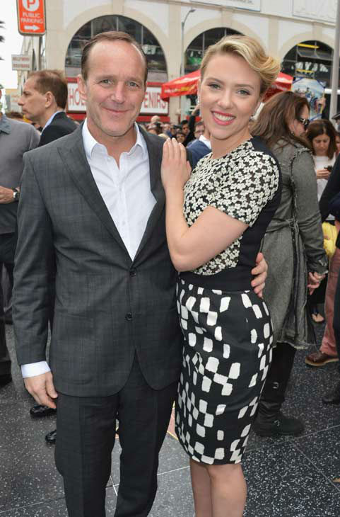 Actor Clark Gregg (L) poses with actress...