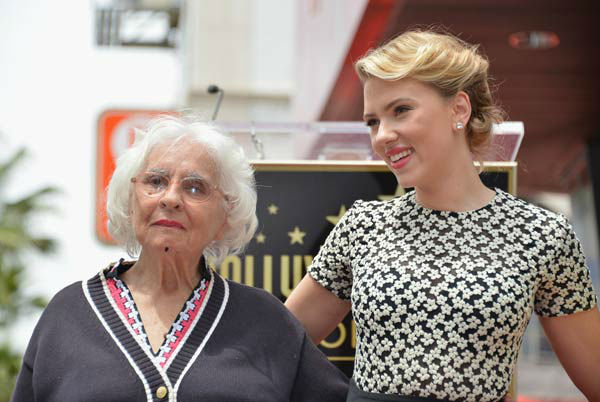 Actress Scarlett Johansson (R) poses with her...