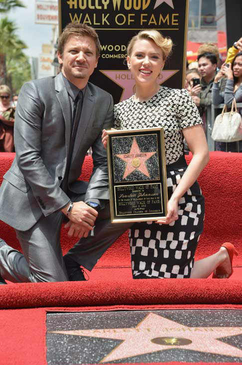 Actor Jeremy Renner (L) poses with actress...