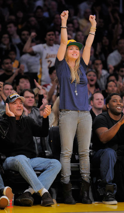 Actress Kaley Cuoco and her father Gary watch...