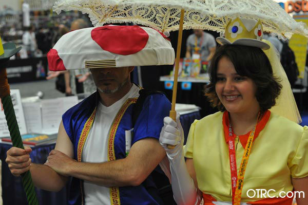 Fans dressed as Toad and Princess Daisy from 'Super Mario Brothers' appears in a photo at San Diego Comic-Con on Friday, July 13, 2012.