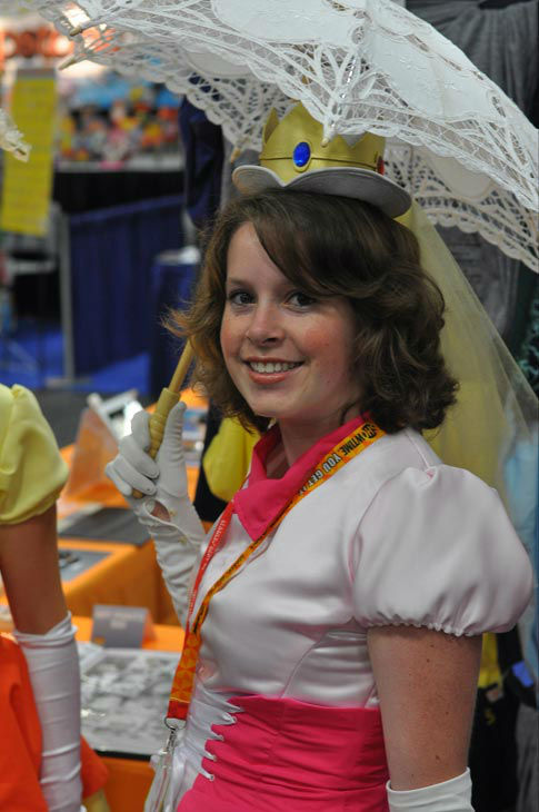 A fan dressed as Princess Peach from 'Super...