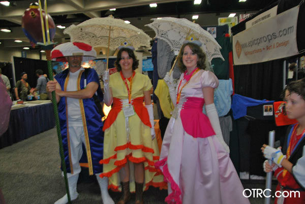 Fans dressed as Toad, Princess Daisy and...
