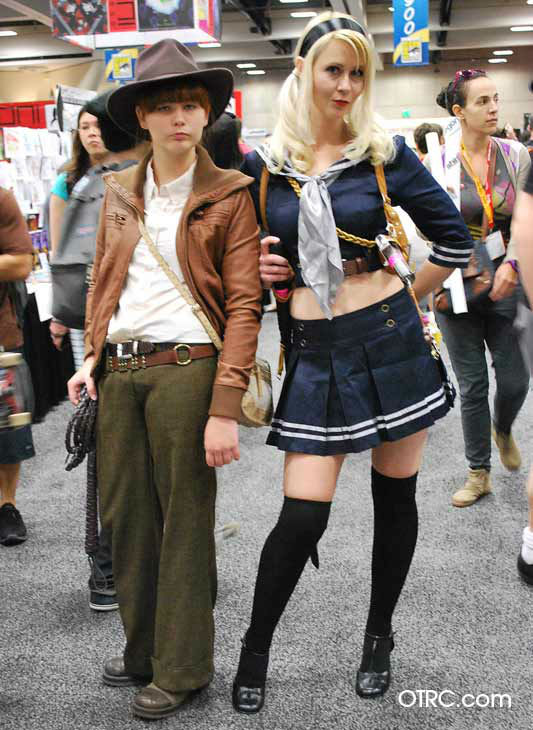 Fans dressed in costumes as Indiana Jones and a...