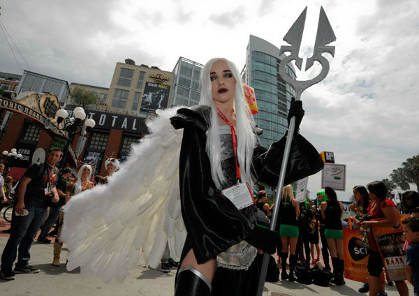 Fan Elizabeth Brinkley poses for photographers...