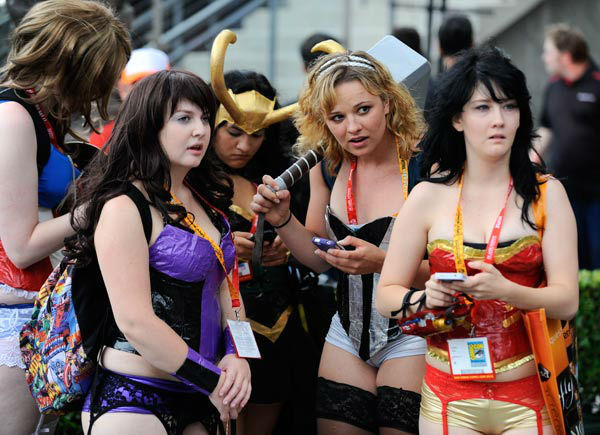 Fans dressed in costumes do a little people...
