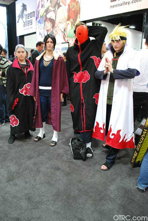 Fans dressed in costumes appear in a photo at...
