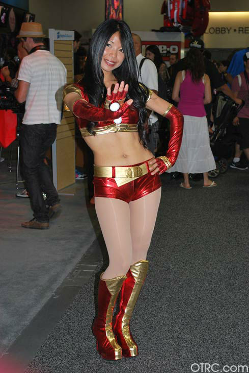 A fan dressed as a female Iron Man appears in a...