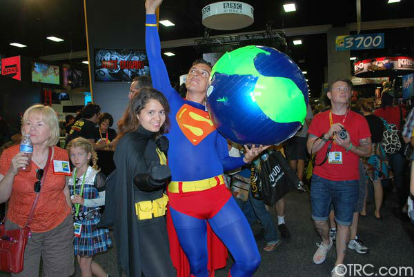 A fan dressed as Superman appears in a photo at...