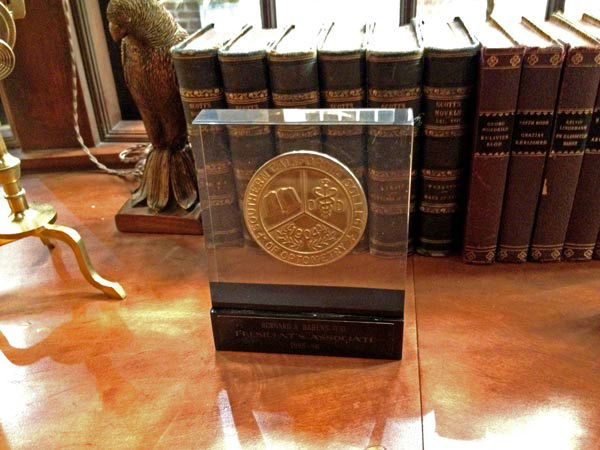 Pictured is an optometry plaque from the desk of...