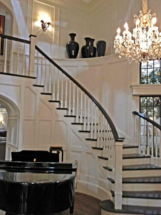 Pictured is a winding staircase and piano inside Grayson Manor from the set of the ABC drama series 'Revenge.' The photo was taken on July 26, 2012, during a set visit by members of the Television Critics Association.