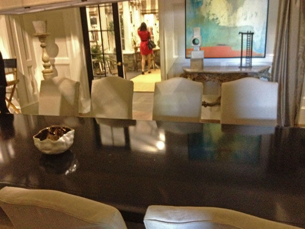 Pictured is a dining room table inside of...