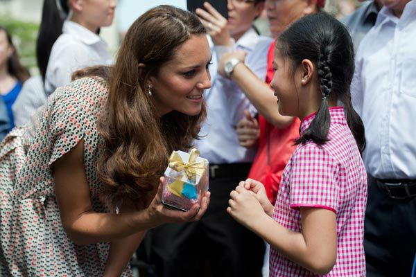 Catherine, the Duchess of Cambridge, receives a...