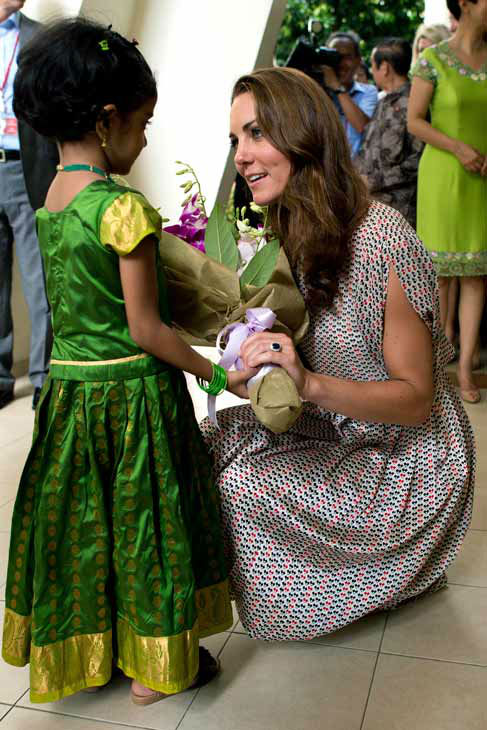 Kate, the Duchess of Cambridge, receives flowers...